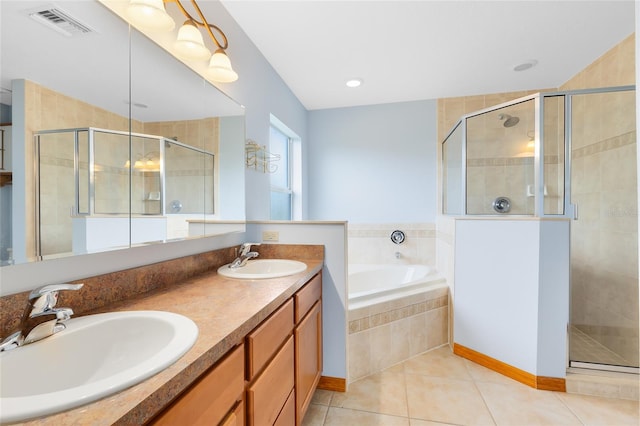 bathroom with tile patterned flooring, plus walk in shower, and vanity