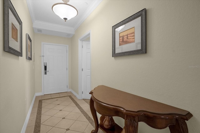 doorway to outside with light tile patterned floors and crown molding