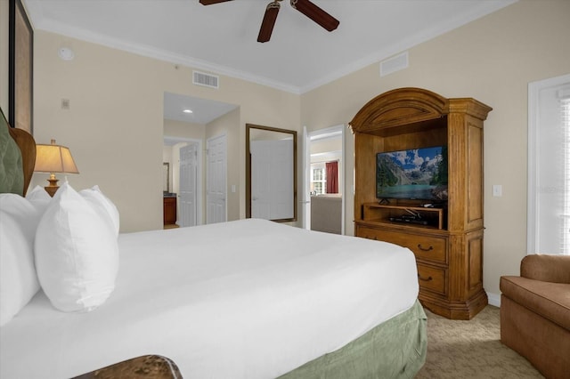 carpeted bedroom featuring ornamental molding and ceiling fan