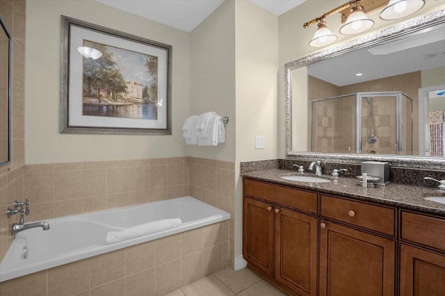 bathroom featuring vanity, tile patterned floors, and separate shower and tub