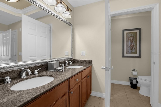 bathroom featuring vanity, tile patterned floors, and toilet