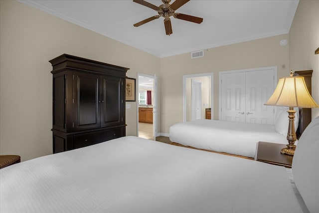 bedroom with ceiling fan, connected bathroom, a closet, and crown molding