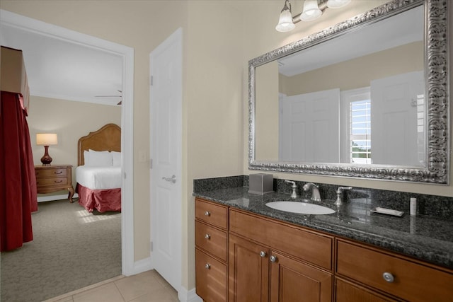 bathroom with vanity, ceiling fan, and tile patterned floors