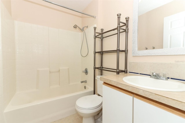 full bathroom featuring toilet, vanity, tile patterned floors, and  shower combination