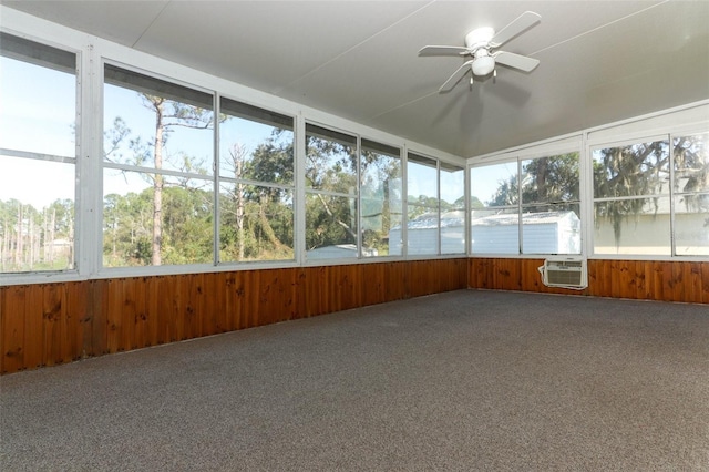 unfurnished sunroom featuring cooling unit and ceiling fan