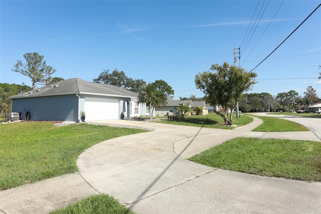 view of front of property featuring a garage and a front yard