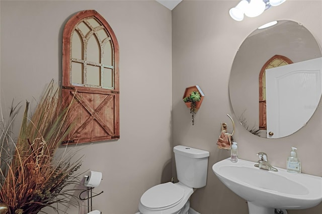 bathroom featuring sink and toilet