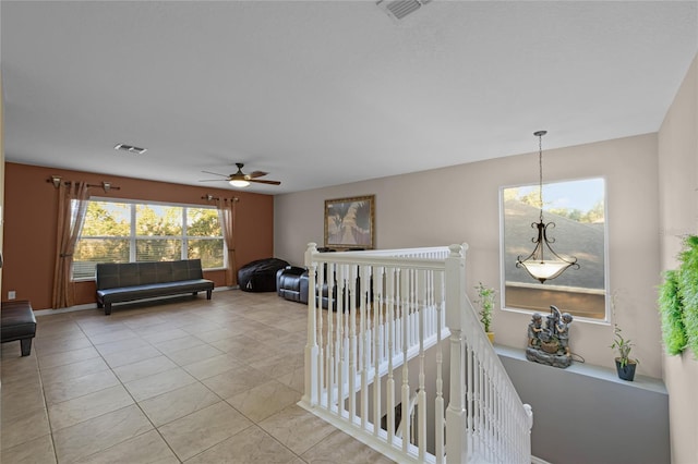 hall with light tile patterned flooring