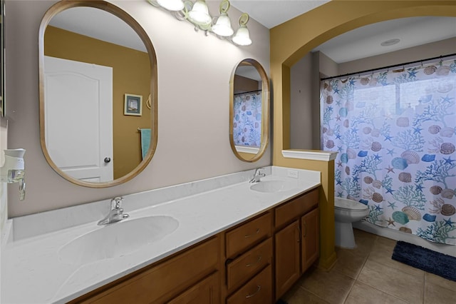 bathroom with toilet, vanity, a shower with shower curtain, and tile patterned flooring