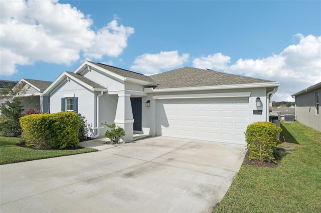 view of front of home featuring a front lawn and a garage