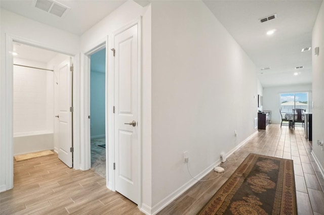 hall with light hardwood / wood-style floors