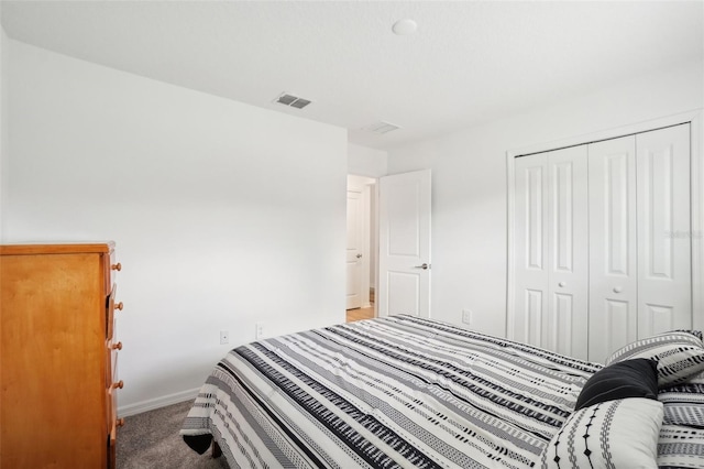 carpeted bedroom with a closet