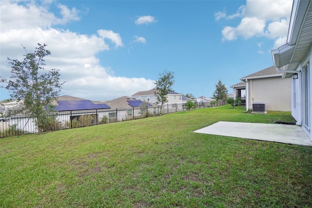 view of yard featuring central air condition unit and a patio