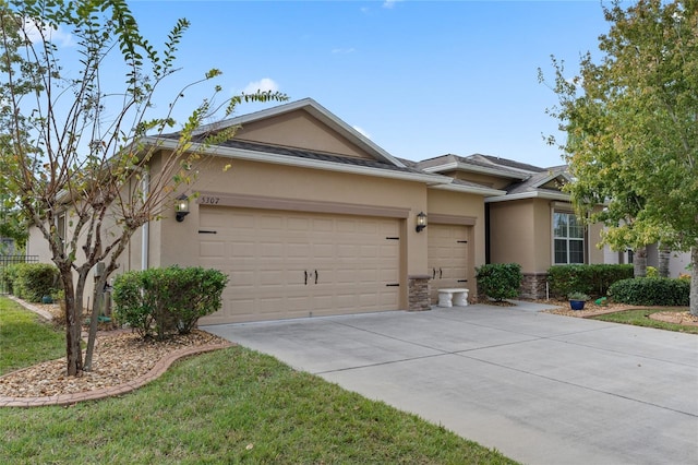 5307 Cortland Dr, Davenport, FL 33837 - single story home with an attached garage, stucco siding, concrete driveway, and stone siding