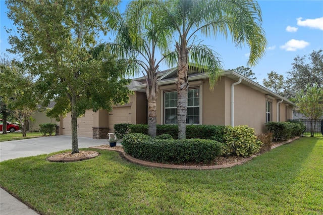 5307 Cortland Dr, Davenport, FL 33837 - view of front of house featuring stucco siding, driveway, and a garage