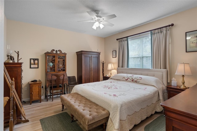5307 Cortland Dr, Davenport, FL 33837 - bedroom with light wood-type flooring and a ceiling fan