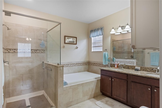 5307 Cortland Dr, Davenport, FL 33837 - bathroom with a garden tub, a stall shower, double vanity, and tile patterned flooring