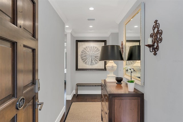 interior space featuring ornamental molding and dark wood-type flooring