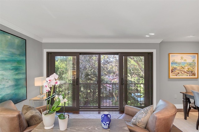 living room featuring ornamental molding and light wood-type flooring