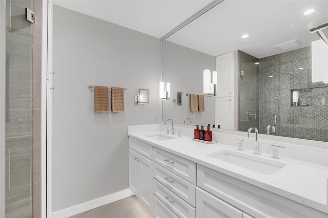 bathroom featuring vanity and a shower with shower door