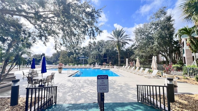 view of swimming pool with a patio area