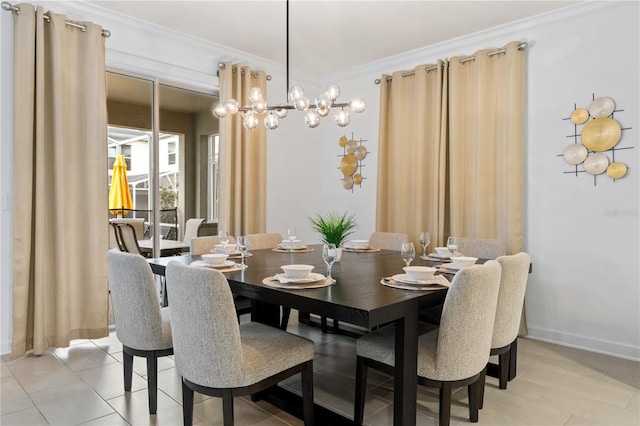 tiled dining room with an inviting chandelier and ornamental molding