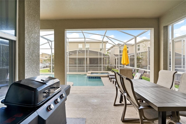 view of pool featuring a lanai, a patio area, an in ground hot tub, and area for grilling