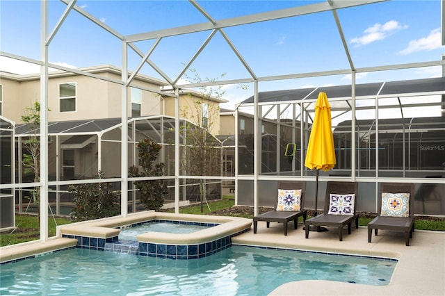 view of swimming pool featuring a lanai, a patio area, and an in ground hot tub