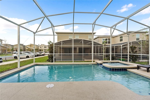 view of pool with glass enclosure and an in ground hot tub