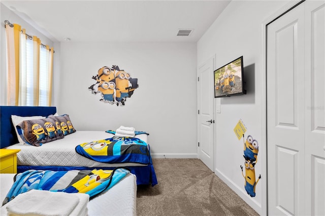 carpeted bedroom featuring a closet