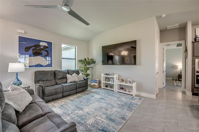 living room with light tile patterned floors, ceiling fan, and lofted ceiling