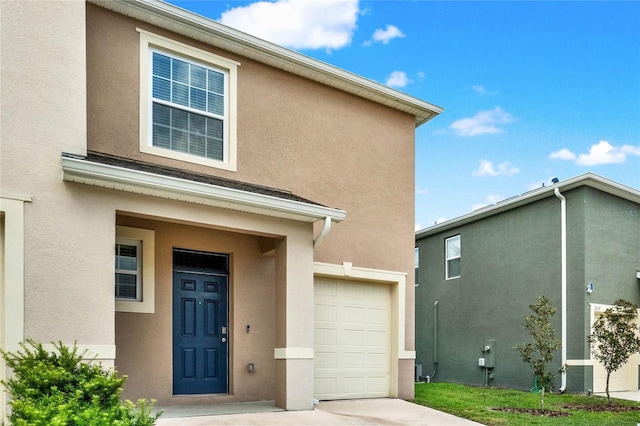 doorway to property featuring a garage