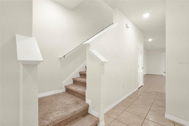 stairway with tile patterned flooring