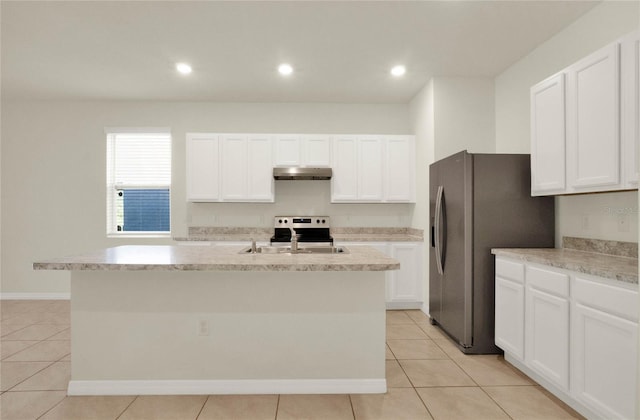 kitchen featuring white cabinetry, a center island with sink, and sink