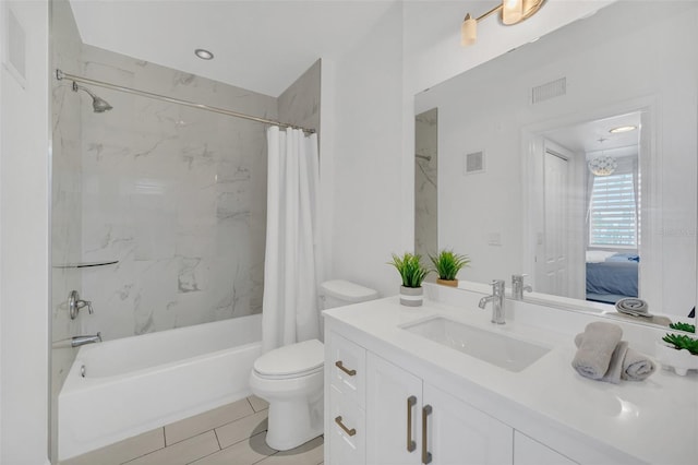 full bathroom featuring tile patterned floors, shower / bath combination with curtain, toilet, and vanity