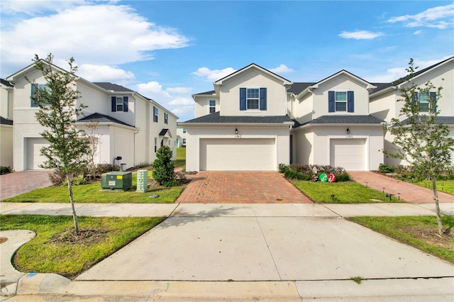 view of front of home with a garage and a front yard