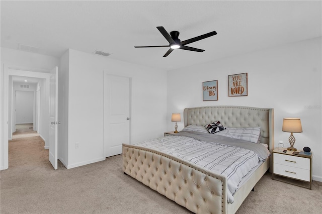 bedroom with light carpet and ceiling fan