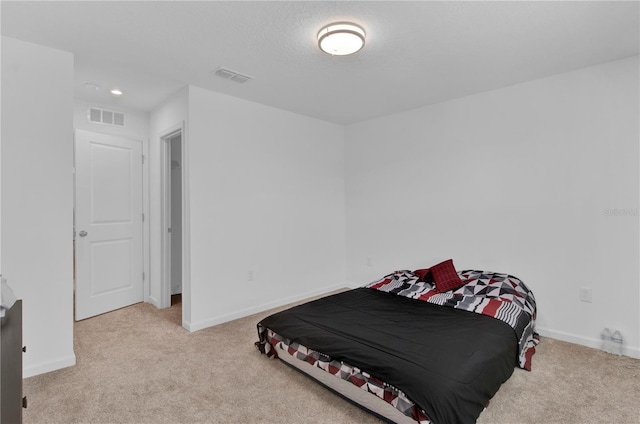 bedroom featuring light carpet