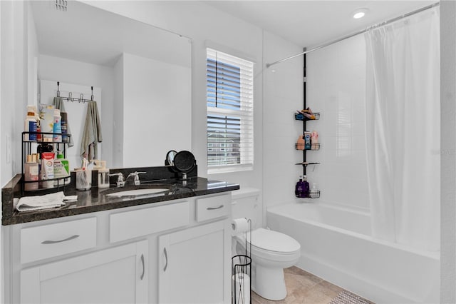 full bathroom with vanity, tile patterned floors, toilet, and shower / tub combo