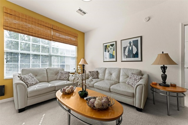 carpeted living room featuring plenty of natural light