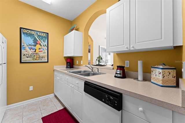 kitchen with white cabinets, light tile patterned flooring, sink, and dishwasher