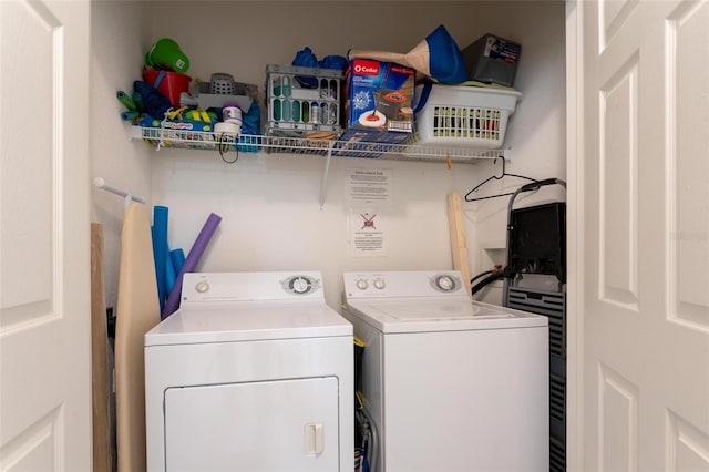 laundry room with separate washer and dryer