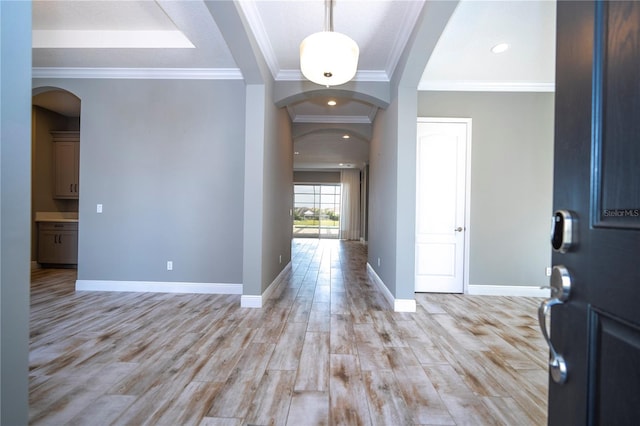 entryway featuring light hardwood / wood-style flooring and ornamental molding