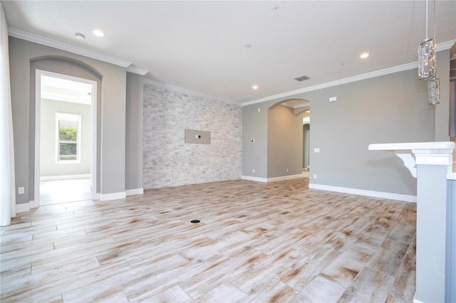 unfurnished living room with light hardwood / wood-style floors and ornamental molding