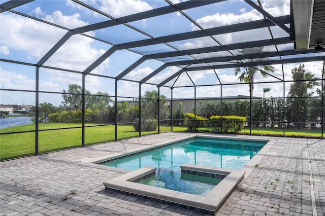 view of pool with a patio area, a lanai, and an in ground hot tub