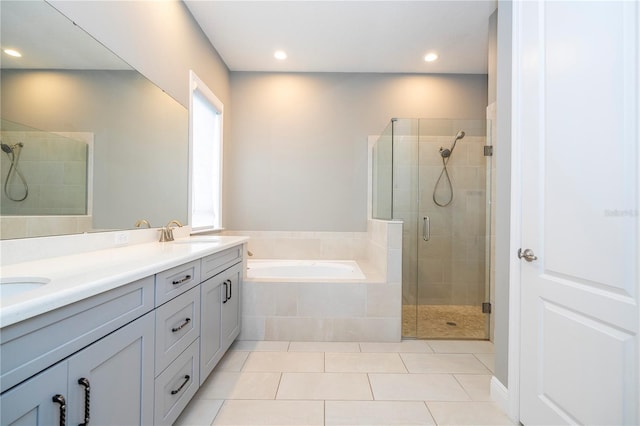 bathroom with separate shower and tub, tile patterned flooring, and vanity