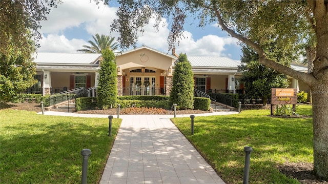 ranch-style home with a porch and a front lawn