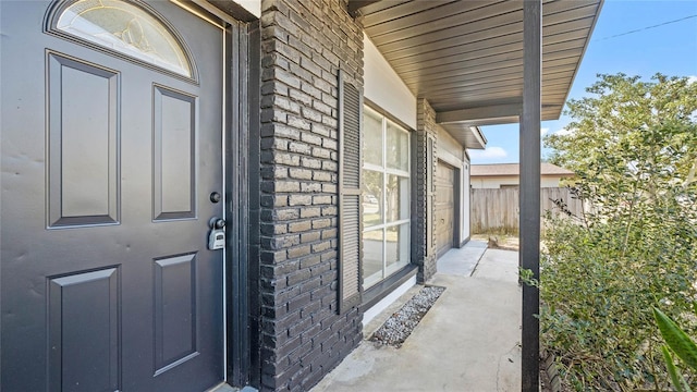 doorway to property with covered porch