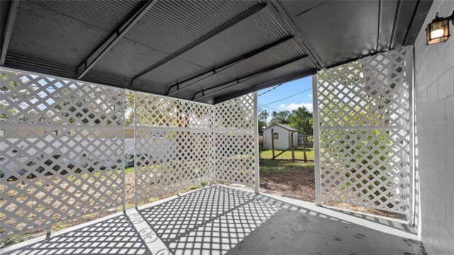 view of patio with a shed