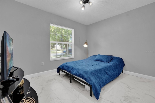 bedroom featuring a textured ceiling